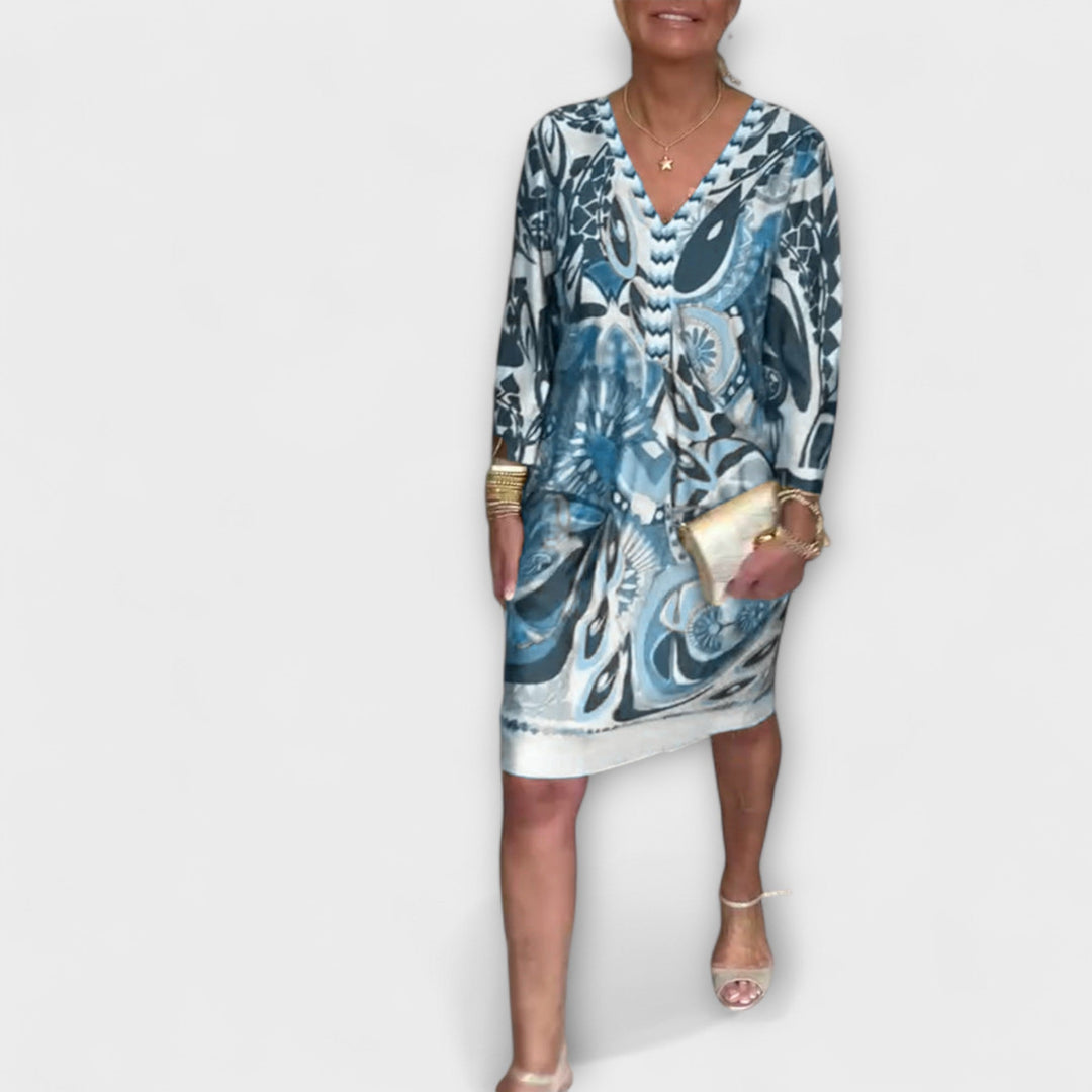 V-hals uvolněné šaty s retro potiskem